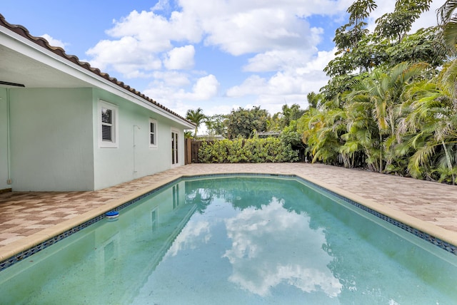 outdoor pool featuring a patio area