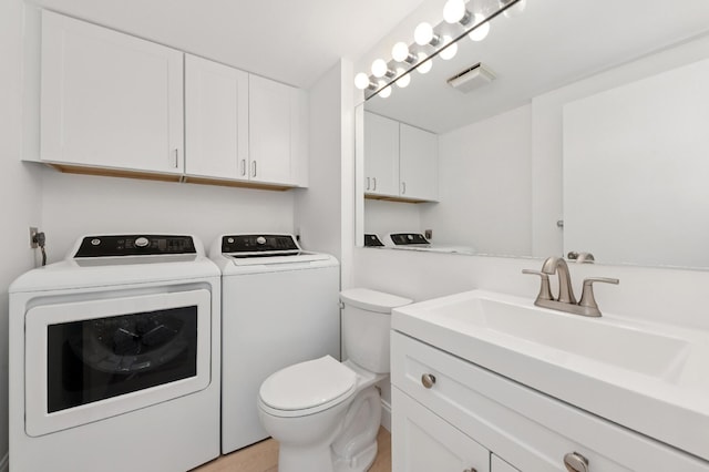 6201 62nd Way, West Palm Beach, FL 33409 - bathroom with vanity, separate washer and dryer, and toilet