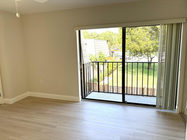 6201 62nd Way, West Palm Beach, FL 33409 - empty room featuring plenty of natural light, light wood-style floors, and baseboards