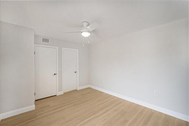 6201 62nd Way, West Palm Beach, FL 33409 - unfurnished bedroom with light wood-style floors, baseboards, and a ceiling fan