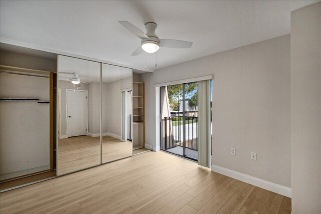 6201 62nd Way, West Palm Beach, FL 33409 - unfurnished bedroom with access to outside, baseboards, light wood-type flooring, ceiling fan, and a closet