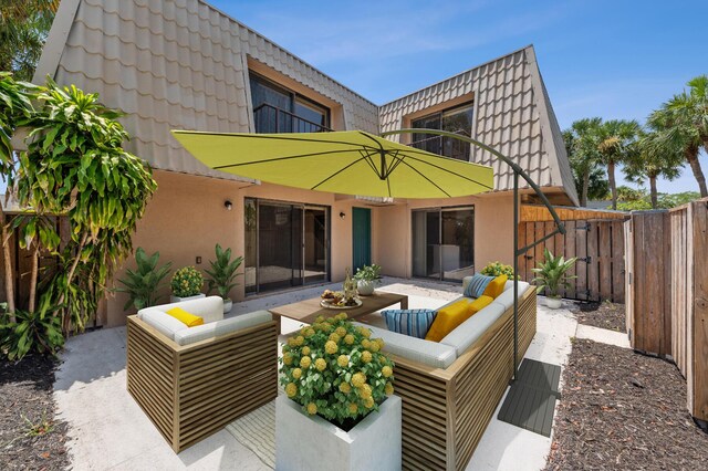6201 62nd Way, West Palm Beach, FL 33409 - rear view of house with an outdoor living space, a patio, a balcony, and stucco siding