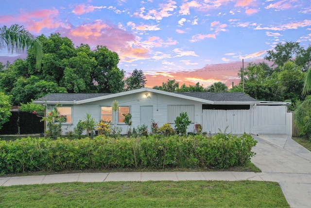 120 Banyan Dr, Port Saint Lucie, FL 34952 - ranch-style house with a front lawn and concrete driveway