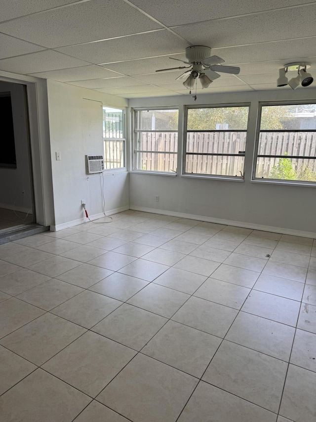 120 Banyan Dr, Port Saint Lucie, FL 34952 - empty room with baseboards, light tile patterned floors, ceiling fan, cooling unit, and a paneled ceiling