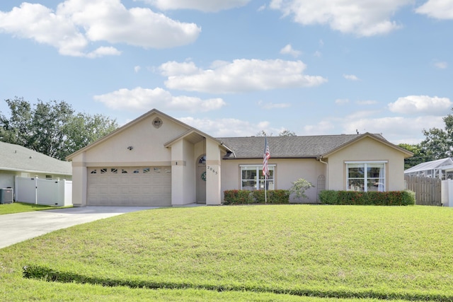 ranch-style home with central AC, concrete driveway, an attached garage, stucco siding, and a front yard