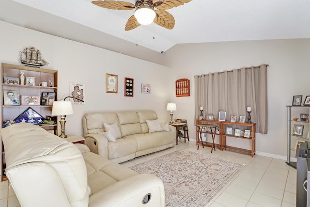 living room with tile patterned floors, a ceiling fan, baseboards, and vaulted ceiling