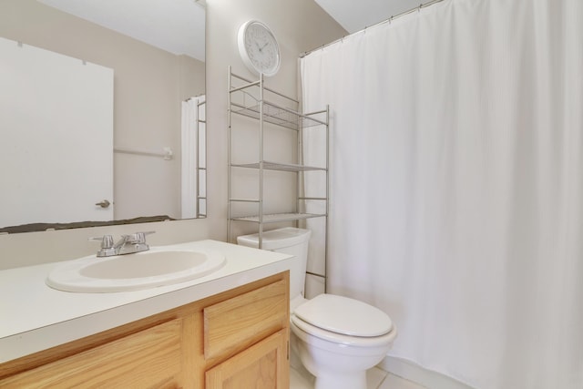 bathroom featuring vanity, a shower with shower curtain, and toilet