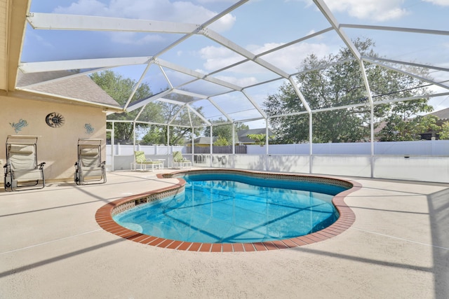 view of swimming pool featuring a fenced backyard, a lanai, a patio area, and a fenced in pool