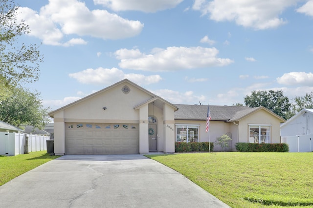 ranch-style house featuring concrete driveway, fence, a garage, a front yard, and stucco siding