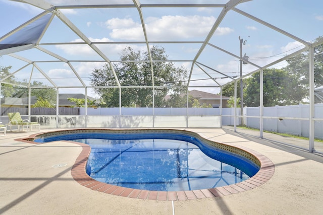 view of swimming pool with a fenced backyard, a lanai, a patio area, and a fenced in pool