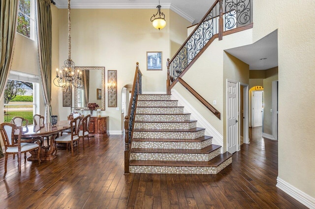 21281 Waycross Dr, Boca Raton, FL 33428 - stairs featuring a high ceiling, arched walkways, hardwood / wood-style flooring, baseboards, and a chandelier