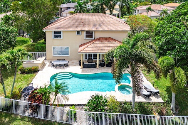 21281 Waycross Dr, Boca Raton, FL 33428 - view of swimming pool with outdoor lounge area, a patio, a fenced backyard, and a pool with connected hot tub