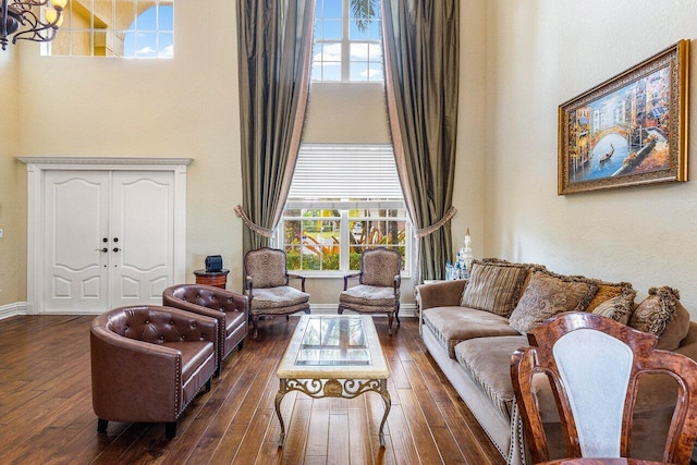21281 Waycross Dr, Boca Raton, FL 33428 - living room with a towering ceiling, dark wood-style flooring, plenty of natural light, and baseboards