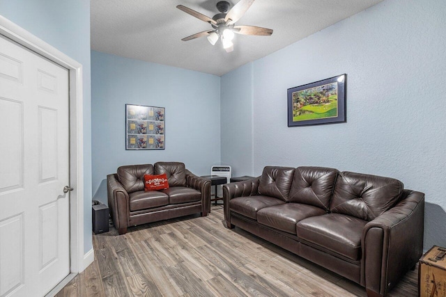 21281 Waycross Dr, Boca Raton, FL 33428 - living room with light wood-style floors, a ceiling fan, and a textured ceiling
