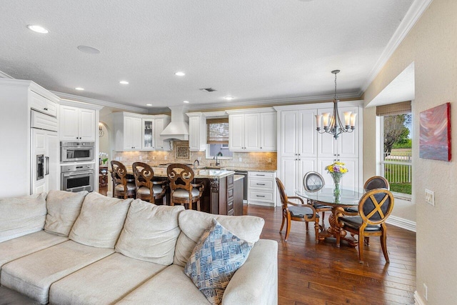 21281 Waycross Dr, Boca Raton, FL 33428 - living area with ornamental molding, a chandelier, dark wood finished floors, baseboards, and a textured ceiling