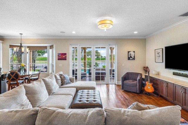 21281 Waycross Dr, Boca Raton, FL 33428 - living area with a chandelier, ornamental molding, hardwood / wood-style floors, a textured ceiling, and recessed lighting