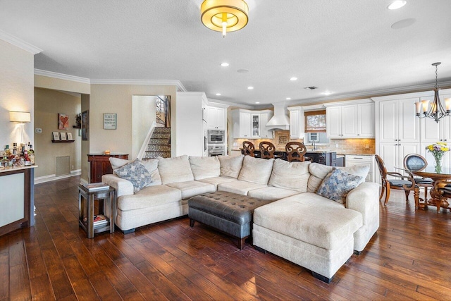 21281 Waycross Dr, Boca Raton, FL 33428 - living room with a chandelier, stairs, ornamental molding, dark wood-style floors, and a textured ceiling