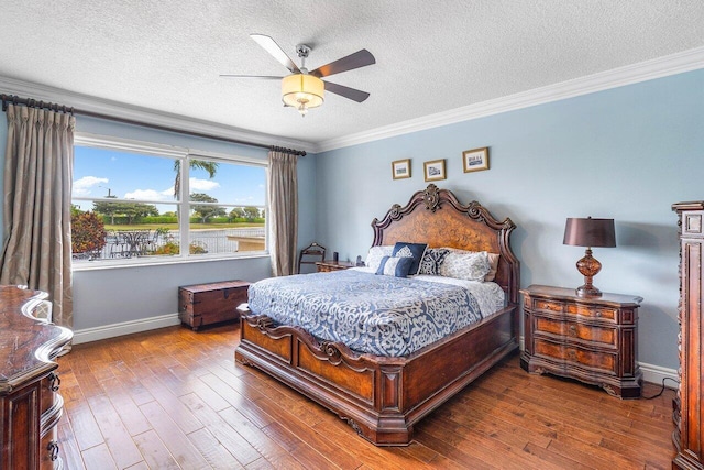 21281 Waycross Dr, Boca Raton, FL 33428 - bedroom with a textured ceiling, hardwood / wood-style floors, baseboards, ornamental molding, and a ceiling fan