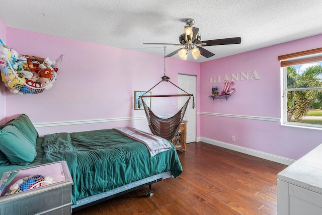 21281 Waycross Dr, Boca Raton, FL 33428 - bedroom featuring wood finished floors, baseboards, a textured ceiling, and a ceiling fan