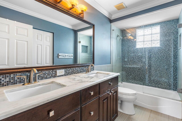 21281 Waycross Dr, Boca Raton, FL 33428 - bathroom featuring double vanity, toilet, bath / shower combo with glass door, crown molding, and decorative backsplash