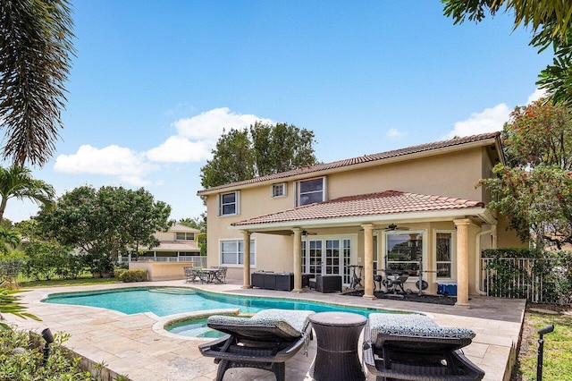 21281 Waycross Dr, Boca Raton, FL 33428 - view of swimming pool with ceiling fan, a patio, french doors, and a pool with connected hot tub