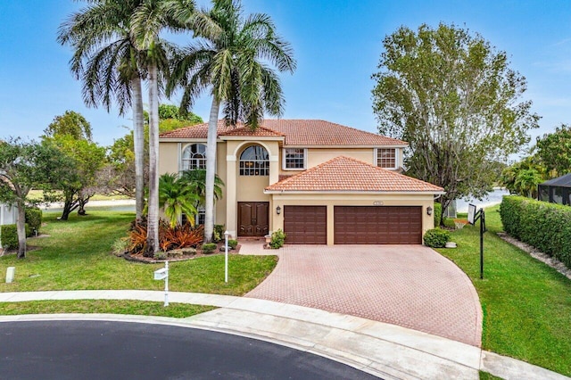 21281 Waycross Dr, Boca Raton, FL 33428 - mediterranean / spanish home featuring decorative driveway, a garage, stucco siding, and a front yard