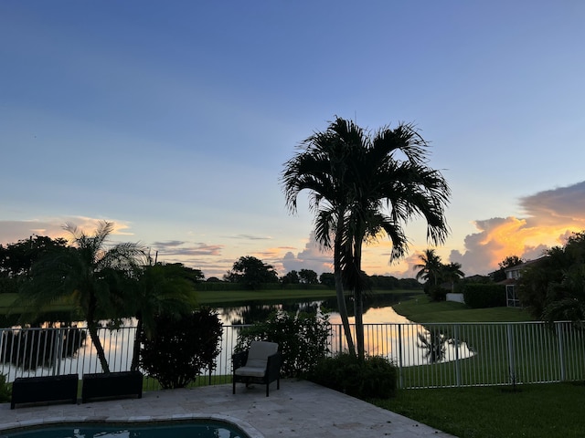 21281 Waycross Dr, Boca Raton, FL 33428 - view of swimming pool with a water view, a fenced backyard, and a patio area