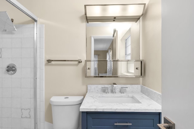 155 Mockingbird Ln, Delray Beach, FL 33445 - full bathroom with a tile shower, vanity, and toilet