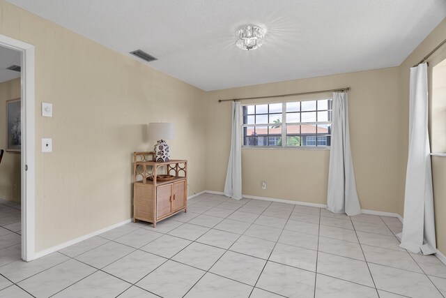 155 Mockingbird Ln, Delray Beach, FL 33445 - unfurnished room featuring baseboards and visible vents