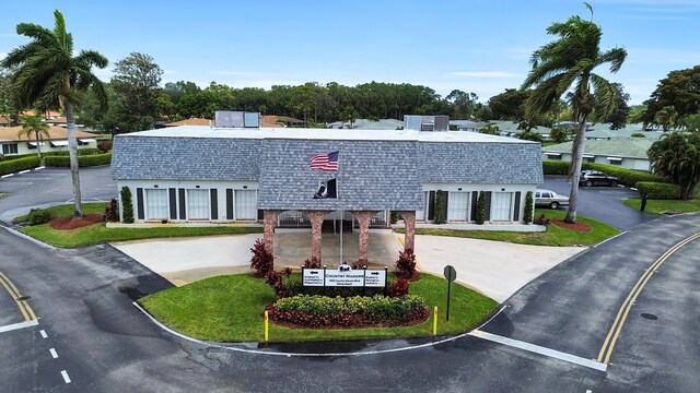 155 Mockingbird Ln, Delray Beach, FL 33445 - view of building exterior with curved driveway