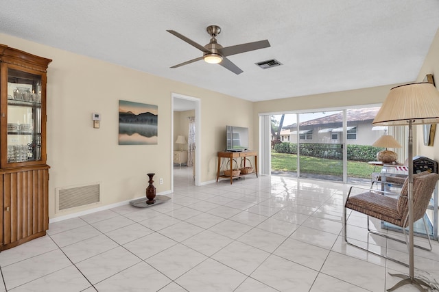 155 Mockingbird Ln, Delray Beach, FL 33445 - sitting room with visible vents, baseboards, a ceiling fan, and light tile patterned flooring