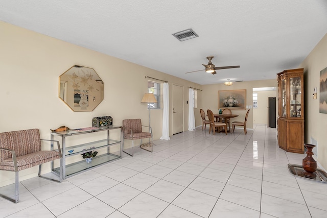 155 Mockingbird Ln, Delray Beach, FL 33445 - living area with visible vents, a ceiling fan, and light tile patterned flooring