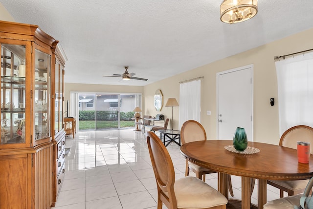 155 Mockingbird Ln, Delray Beach, FL 33445 - dining room with a ceiling fan, light tile patterned flooring, and a textured ceiling