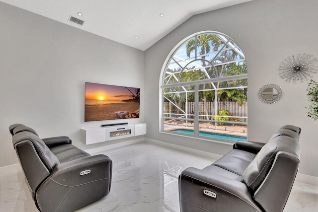 living room featuring visible vents, baseboards, marble finish floor, and vaulted ceiling