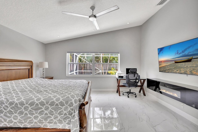 bedroom featuring marble finish floor, vaulted ceiling, and a textured ceiling