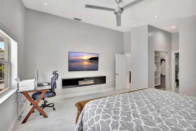 bedroom with visible vents, ceiling fan, recessed lighting, marble finish floor, and a glass covered fireplace
