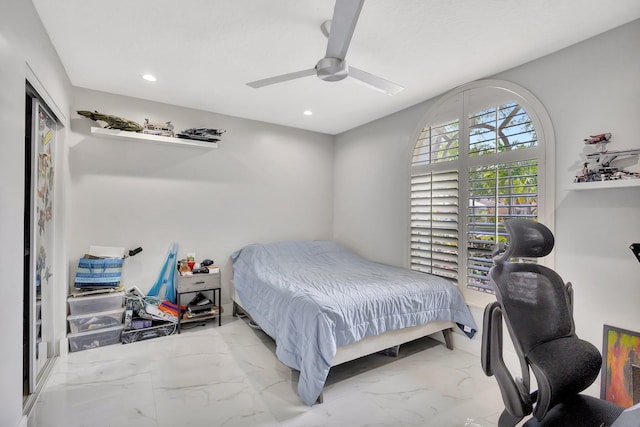 bedroom with ceiling fan, recessed lighting, and marble finish floor