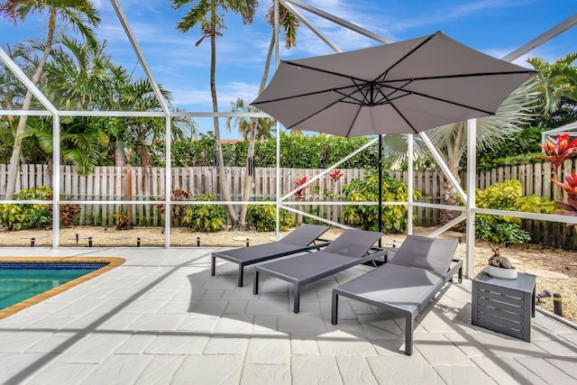 view of patio / terrace with a fenced backyard, a fenced in pool, and a lanai