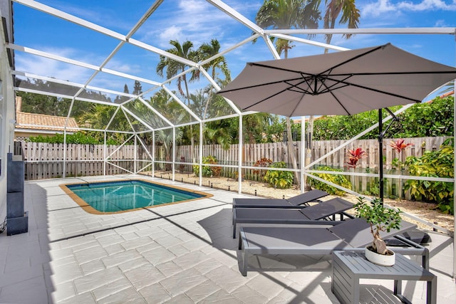 view of pool featuring a patio area, a fenced backyard, and a lanai