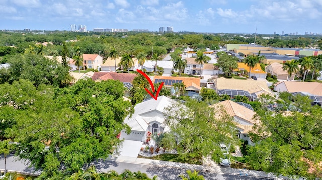 birds eye view of property featuring a view of city and a residential view
