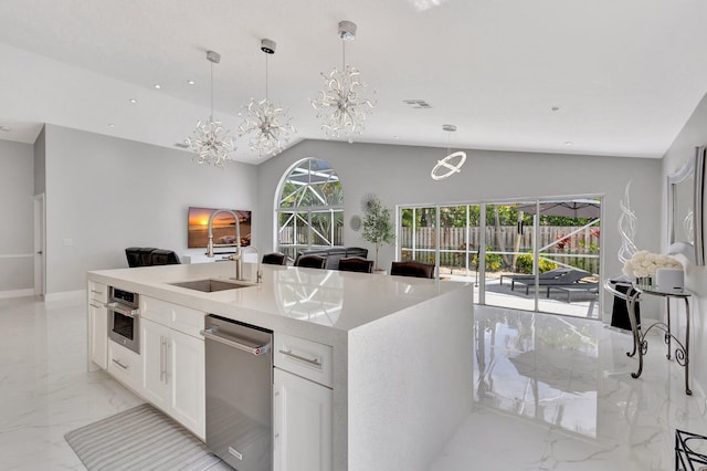 kitchen featuring visible vents, appliances with stainless steel finishes, marble finish floor, a sink, and open floor plan