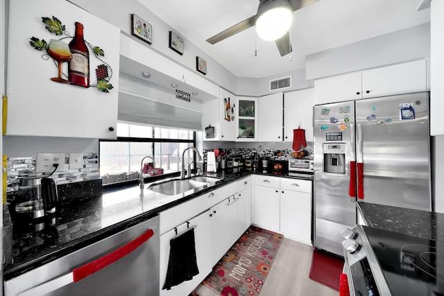 3750 NW 73rd Way, Coral Springs, FL 33065 - kitchen featuring stainless steel appliances, a ceiling fan, a sink, dark wood finished floors, and white cabinetry
