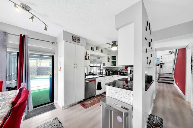 3750 NW 73rd Way, Coral Springs, FL 33065 - kitchen with dishwasher, a sink, dark countertops, light wood finished floors, and a ceiling fan