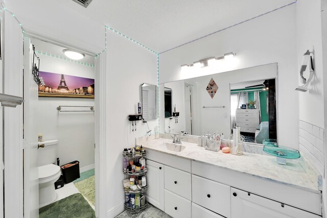 3750 NW 73rd Way, Coral Springs, FL 33065 - bathroom with toilet, connected bathroom, vanity, and baseboards