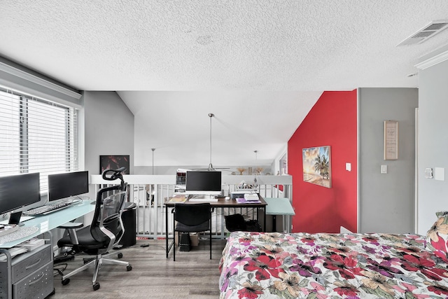 3750 NW 73rd Way, Coral Springs, FL 33065 - bedroom featuring wood finished floors, a textured ceiling, a desk, and vaulted ceiling