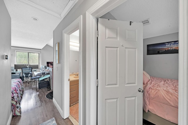 3750 NW 73rd Way, Coral Springs, FL 33065 - corridor with a desk, a textured ceiling, and wood finished floors