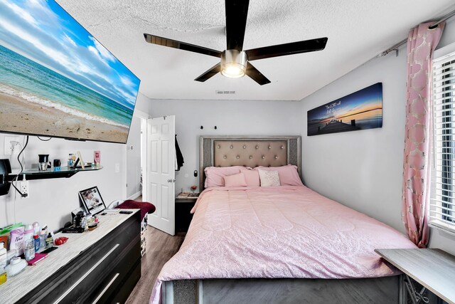 3750 NW 73rd Way, Coral Springs, FL 33065 - bedroom featuring dark wood finished floors, a textured ceiling, and ceiling fan
