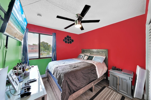 3750 NW 73rd Way, Coral Springs, FL 33065 - bedroom featuring wood finished floors, a textured ceiling, a ceiling fan, and baseboards