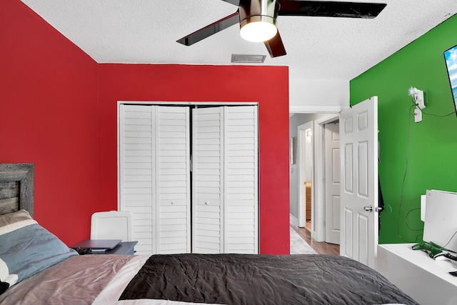 3750 NW 73rd Way, Coral Springs, FL 33065 - bedroom with a textured ceiling, a closet, ceiling fan, and wood finished floors