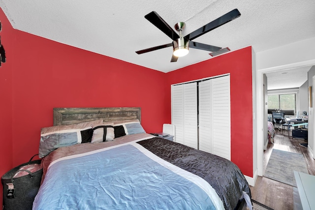 3750 NW 73rd Way, Coral Springs, FL 33065 - bedroom with wood finished floors, ceiling fan, a closet, a textured ceiling, and baseboards